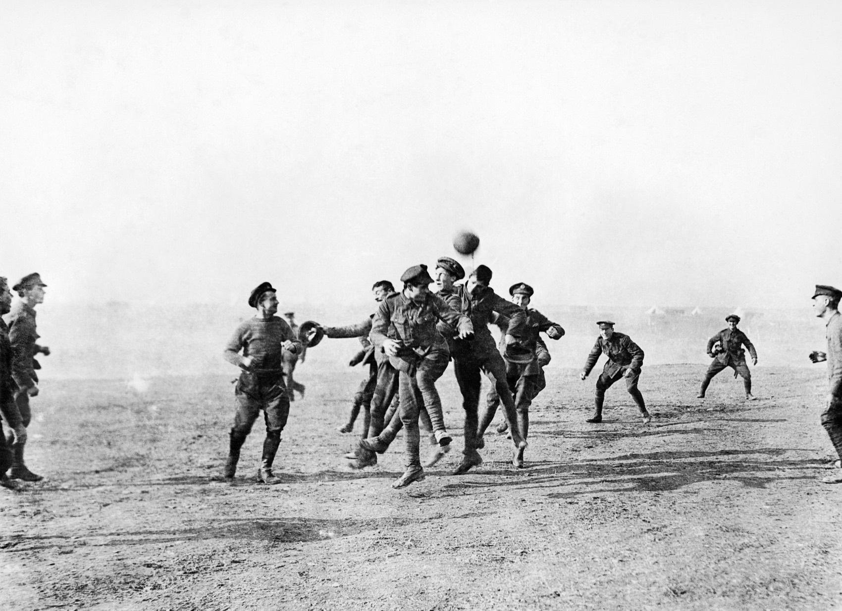 British and German soldiers playing football together in no man’s land during the 1914 Christmas Truce of the First World War.